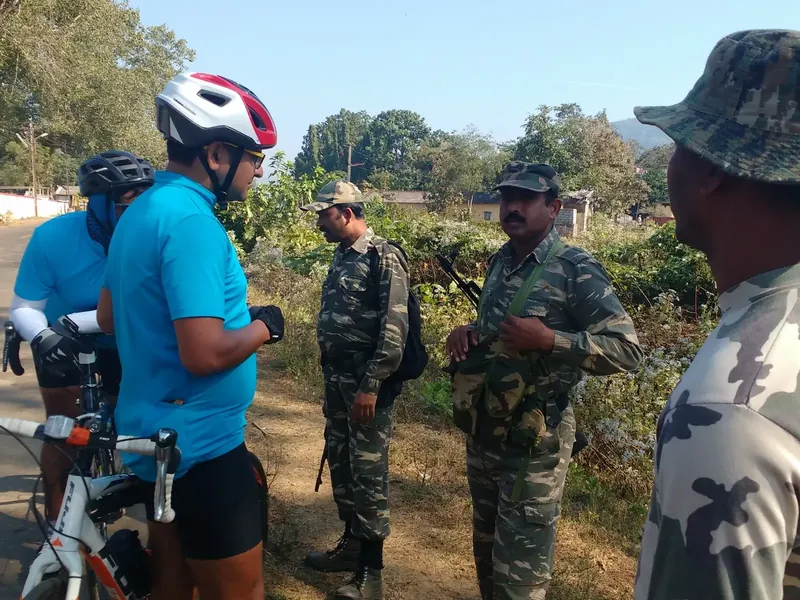 Our first supported bike tour, from Hyderabad to Rajahmundry. Ritesh and Bharathan getting cautioned by CRPF officers at Donkarayi about the Naxal activities in the region