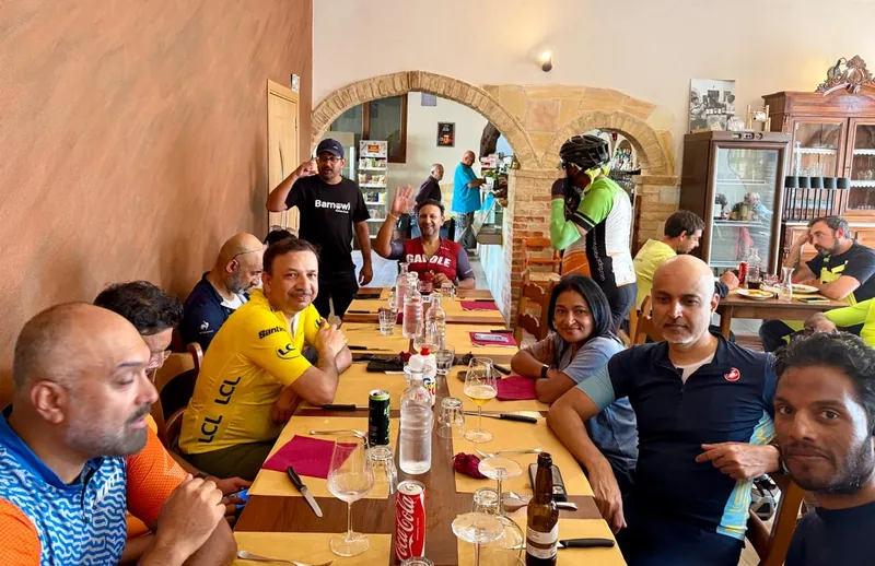 The group at a long lunch table in a taverna